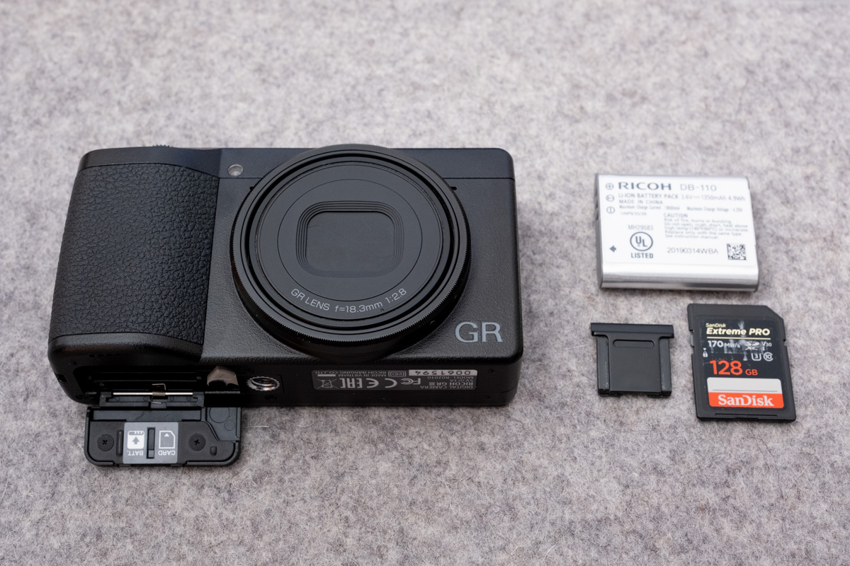 Ricoh GR III camera with battery, SD card, and hotshoe cover removed.